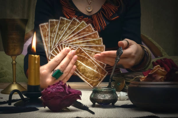 Picture of a lady holding cards.