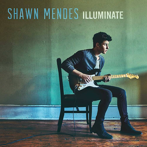 Photo of Shawn Mendes playing guitar