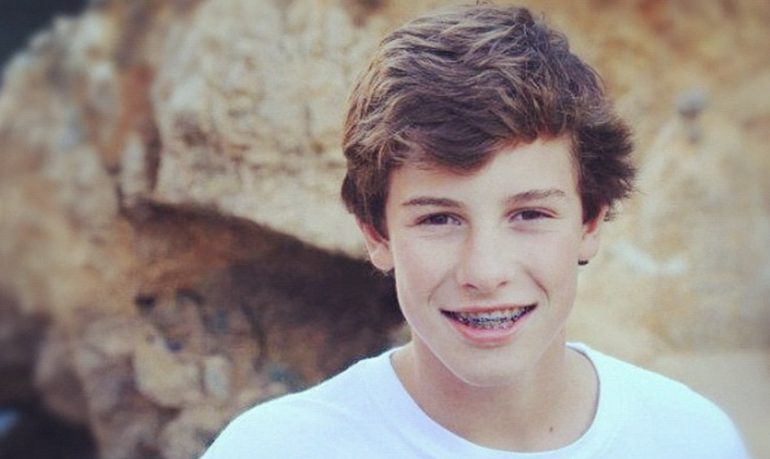 Photo of Shawn Mendes when he was younger in a white shirt