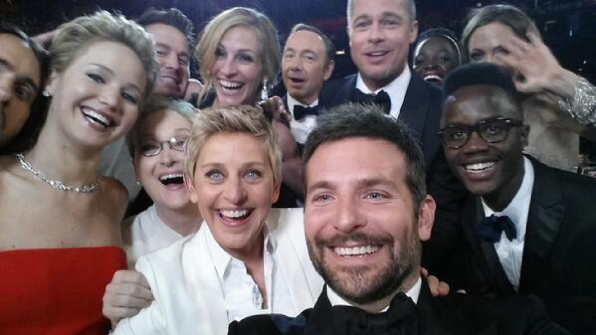 ellen degeneres and other celebrities taking a picture