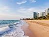 Miami beach with water and sand and buildings