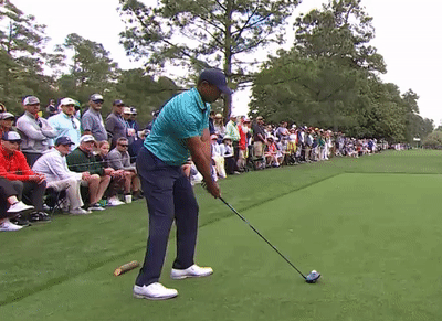 Tiger Woods driving off the tee box