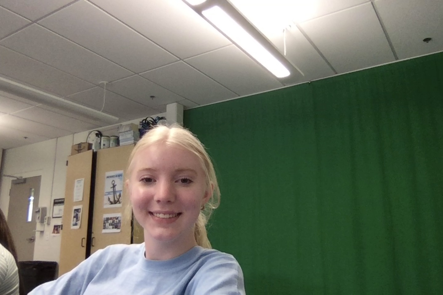 Photo of Avery at her desk