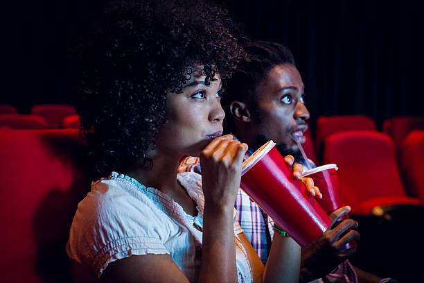 people at the movies eating and drinking food