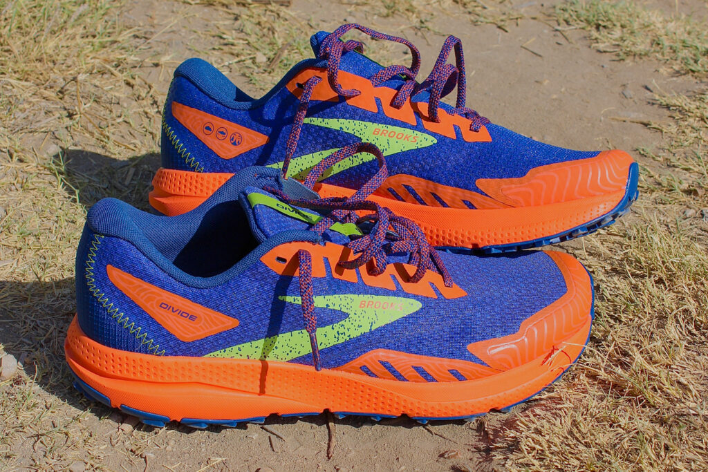 blue and orange brooks shoe