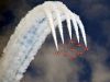 Airplanes in formation releasing smoke
