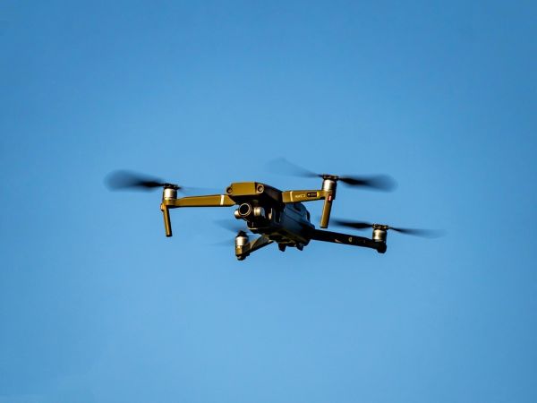 Small camera drone hovering