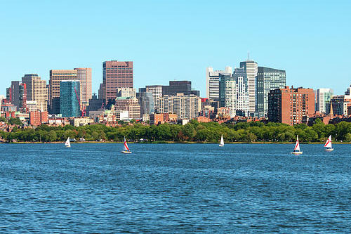 Photo of Boston on a sunny day and the charles river in front