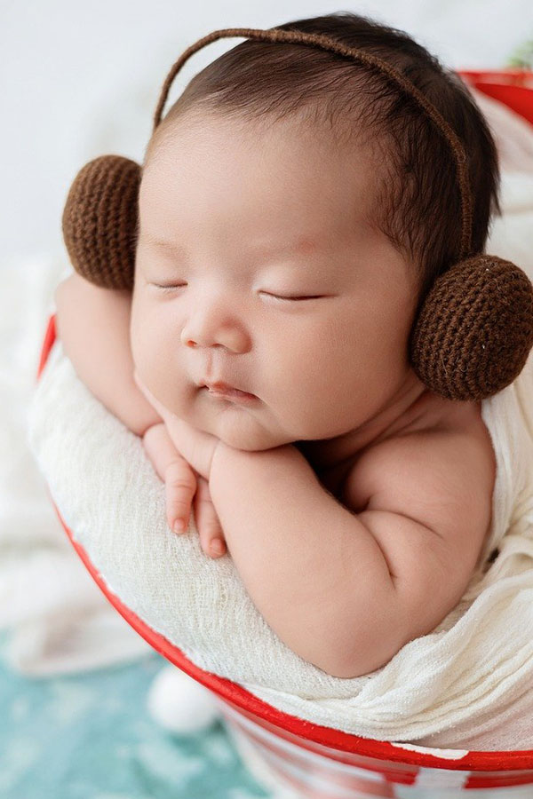 cute baby with earmuffs