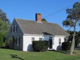 A quaint cape cod style house in autumn.