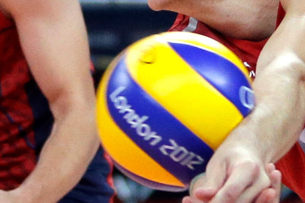 Volleyball players hitting the balls